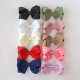 Sustainable recycled polyester 4 inch matte satin bow headband in a variety of colors