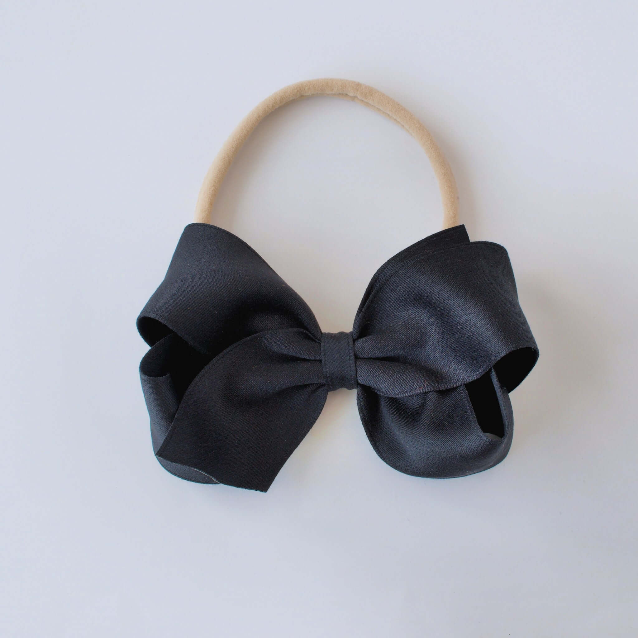 Sustainable recycled polyester 4 inch matte satin bow headband for newborn to girls in black