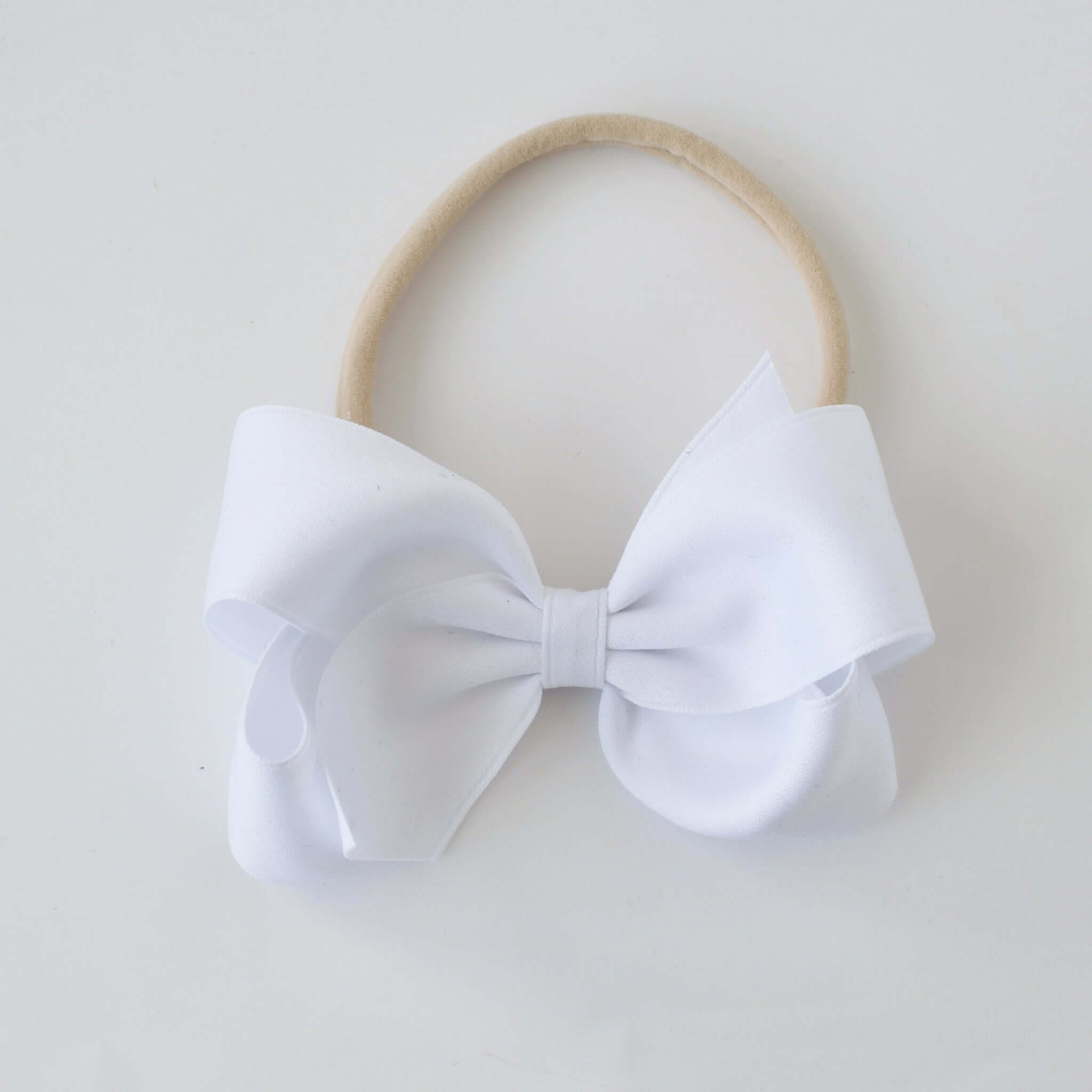 Sustainable recycled polyester 4 inch matte satin bow headband for newborn to girls in white