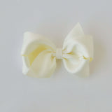 Sustainable recycled polyester 4 inch matte satin hair bow for toddlers to girls in ivory