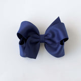 Sustainable recycled polyester 4 inch matte satin hair bow for toddlers to girls in navy