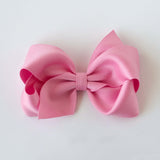 Sustainable recycled polyester 4 inch matte satin hair bow for toddlers to girls in pink
