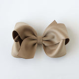 Sustainable recycled polyester 4 inch matte satin hair bow for toddlers to girls in taupe