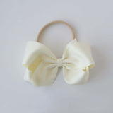 Sustainable recycled polyester matte satin bow headband for newborn to girls in ivory