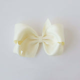 Sustainable recycled polyester 5 inch matte satin hair bow for toddlers to girls in ivory