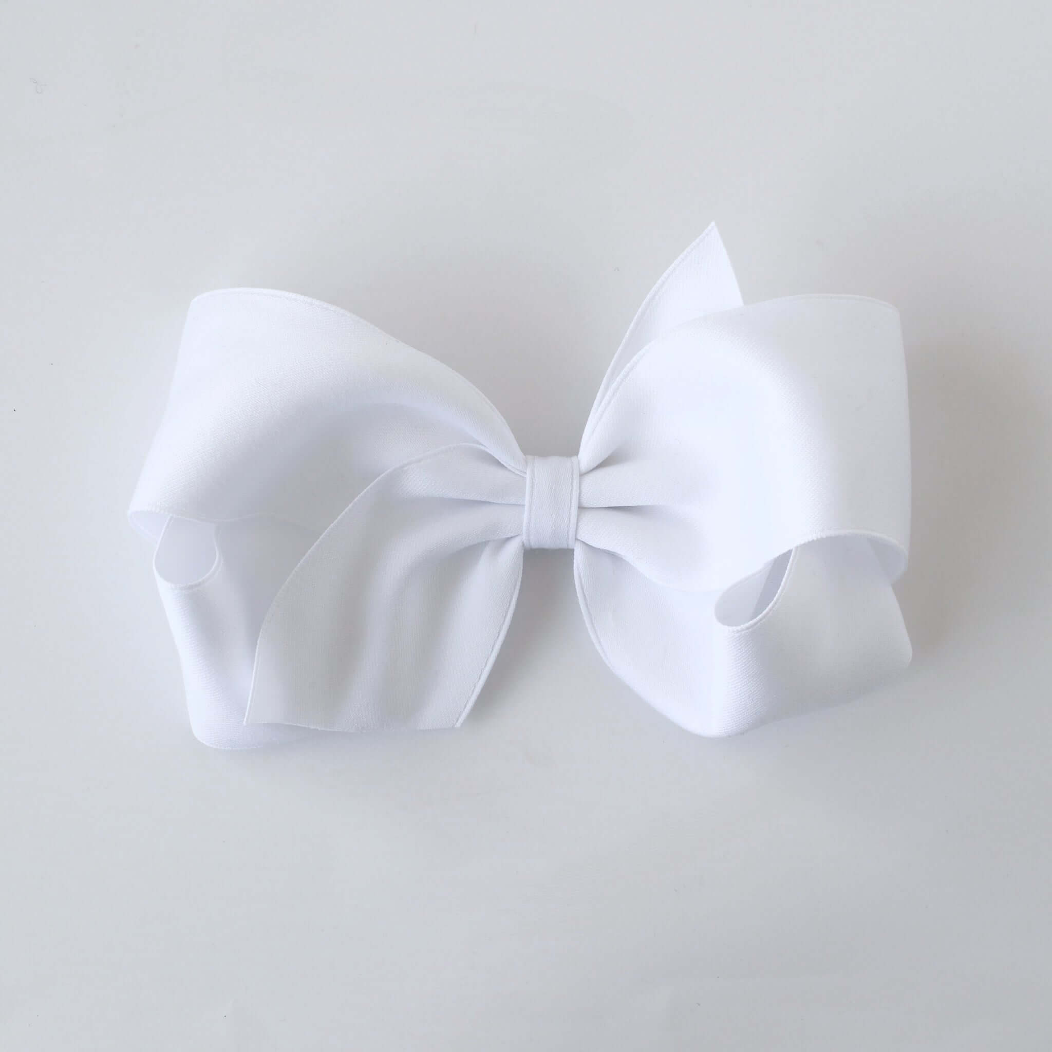 Sustainable recycled polyester 5 inch matte satin hair bow for toddlers to girls in white