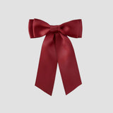 Mia Satin Hair Bow in Brick Red on a white background