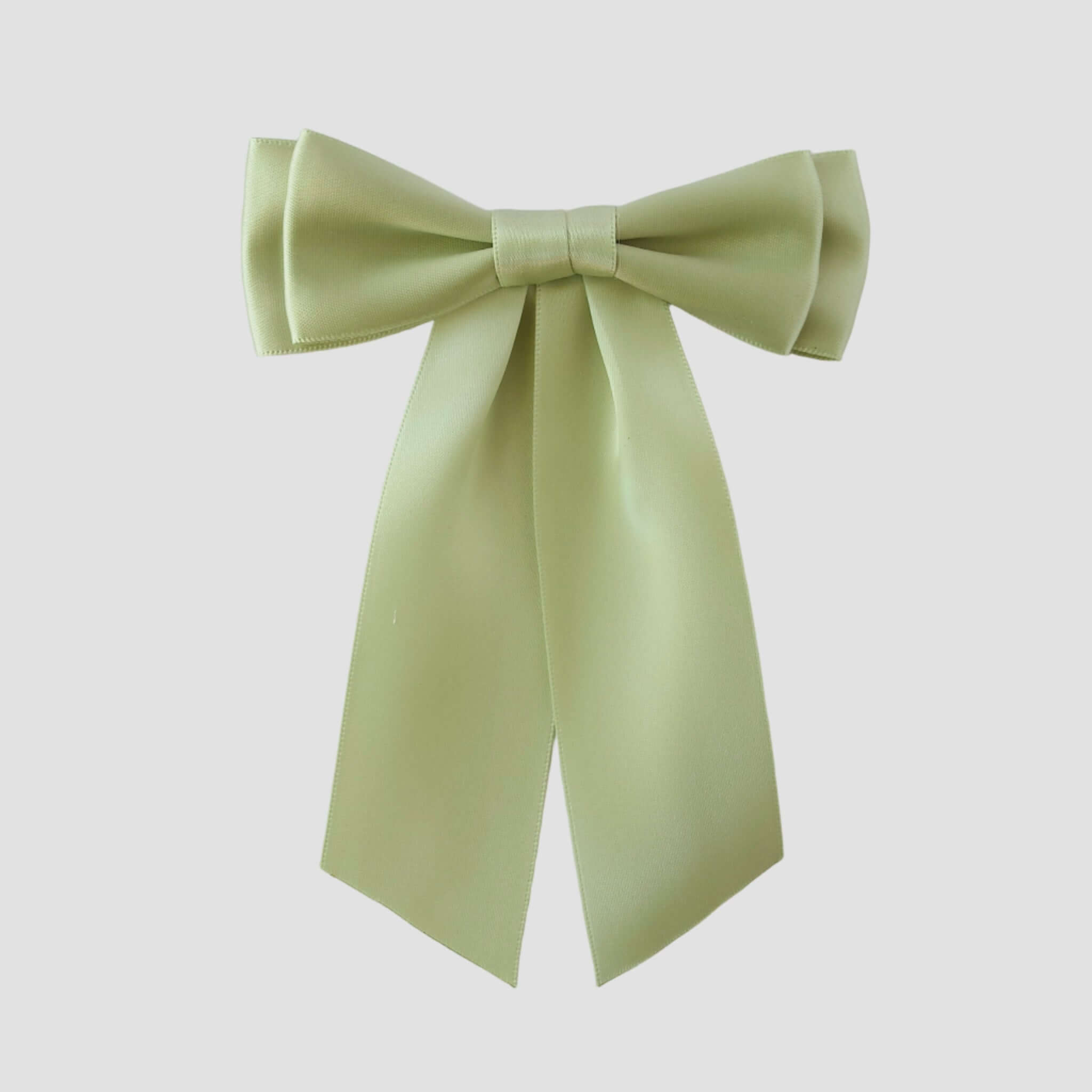 Mia Satin Hair Bow in Celadon, Light green bow on a white background