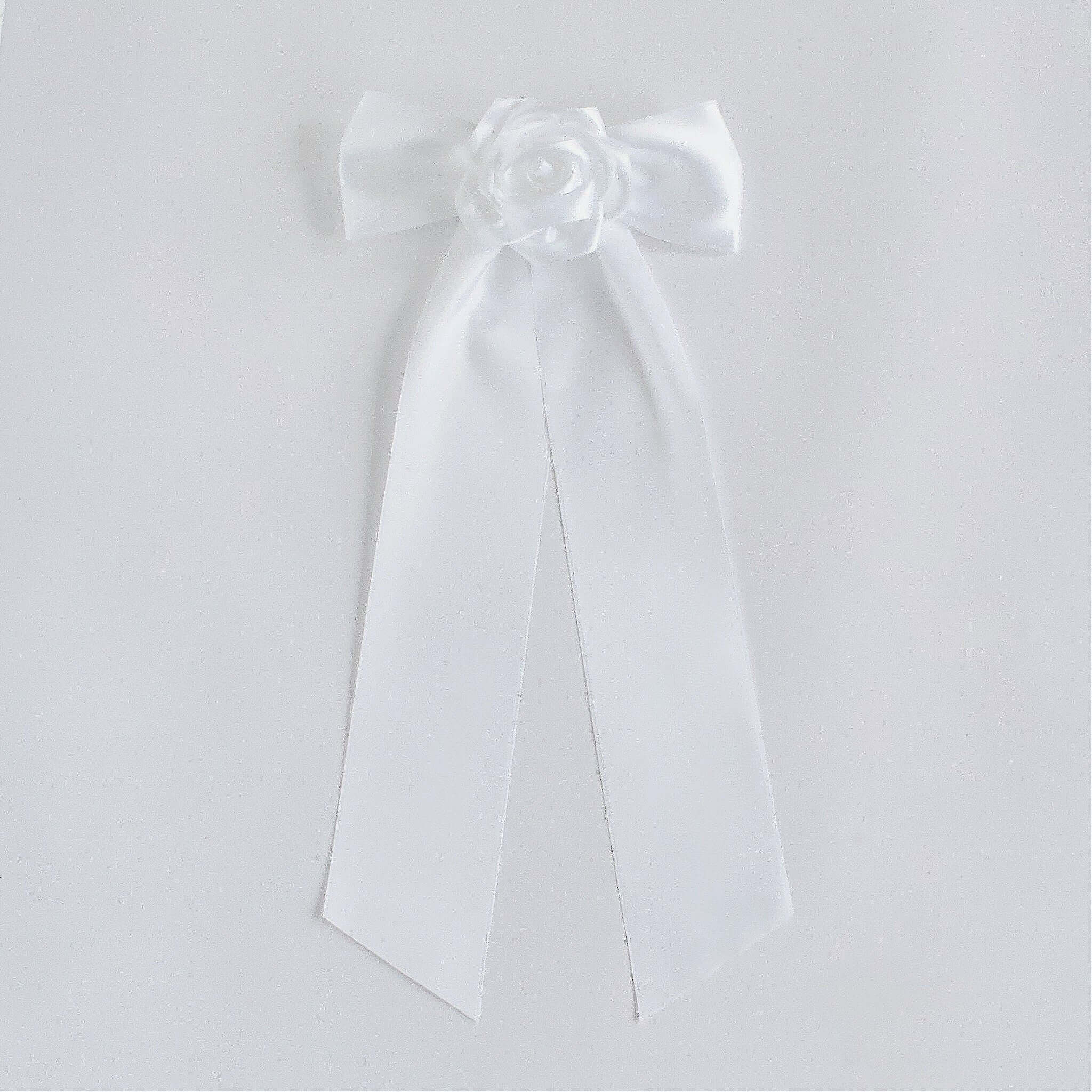 White satin Zoe bow with long tails and rose center, bridal hair accessory