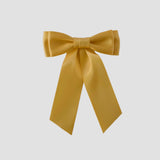 Mia Satin Hair Bow in Golden Yellow on a white background