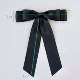 Handmade satin hair bow in black – elegant accessory for women and girls.