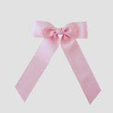 Light pink grosgrain Zoe Petite bow on a white background