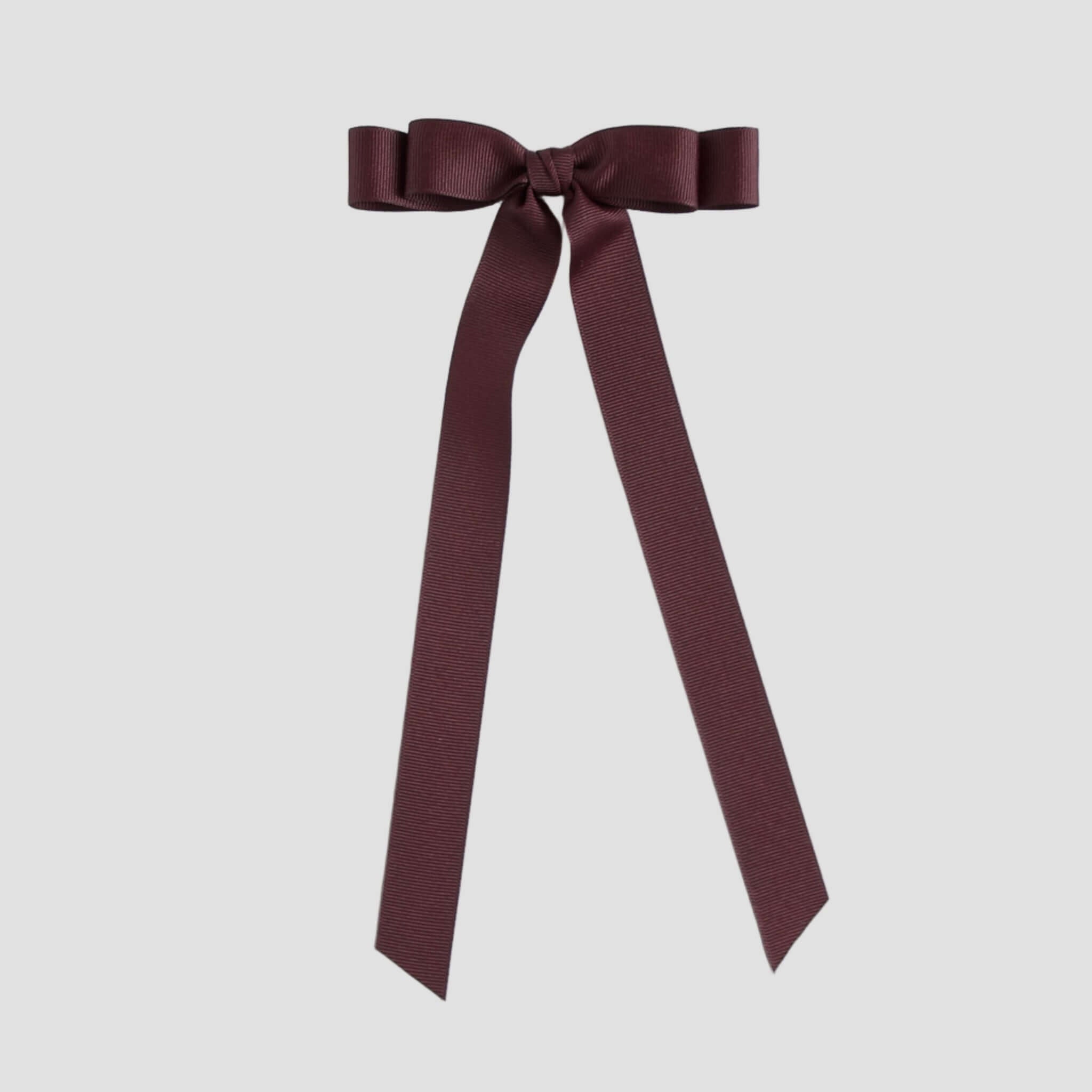 Maroon ribbon bow on a white background