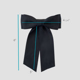 Ruler showing the measurement of Mia Satin Bow - 4.25 bow and 5 inch tails.