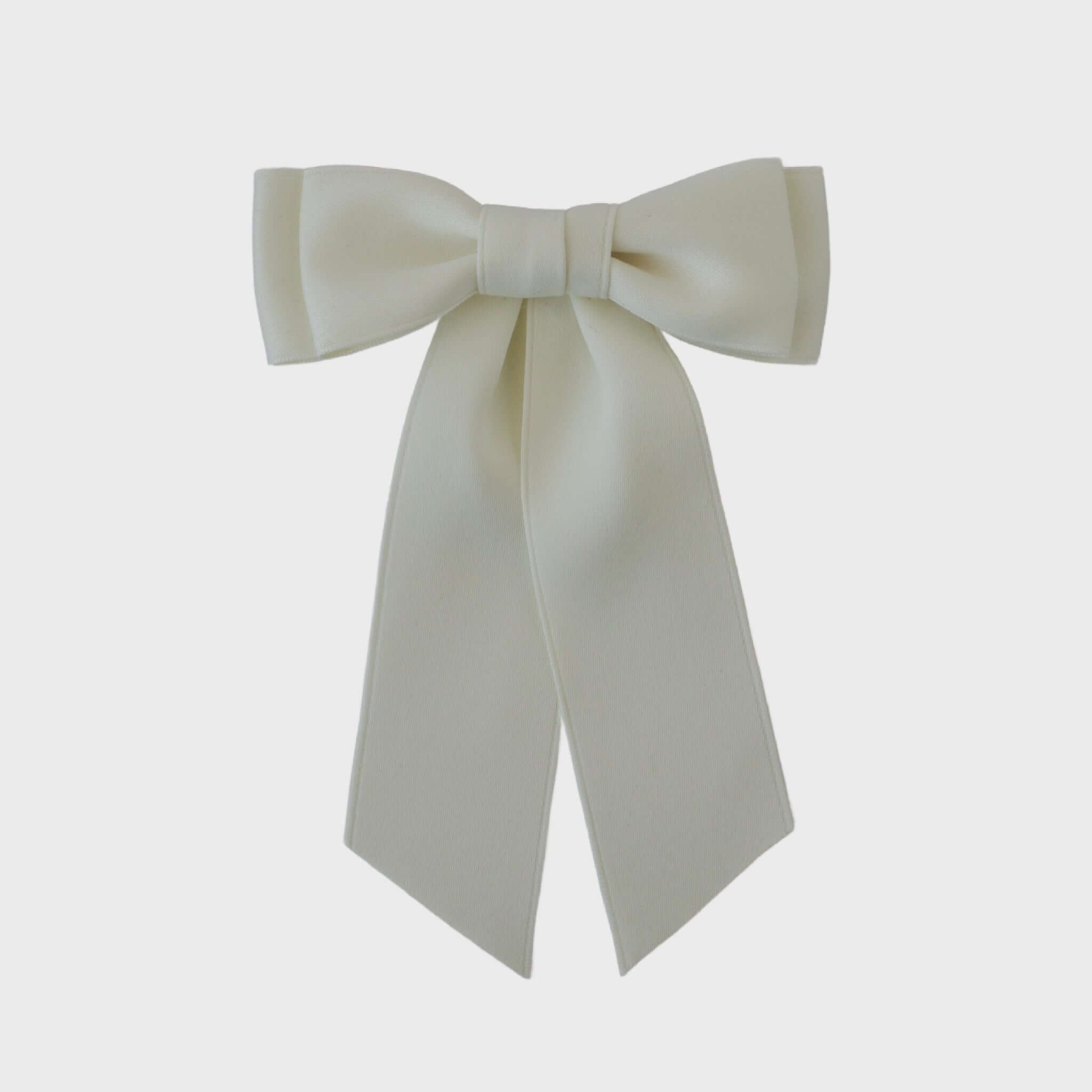 Mia Matte Satin Bow in ivory, handmade with recycled satin ribbon, perfect for young girls, toddlers, and women with short hair.