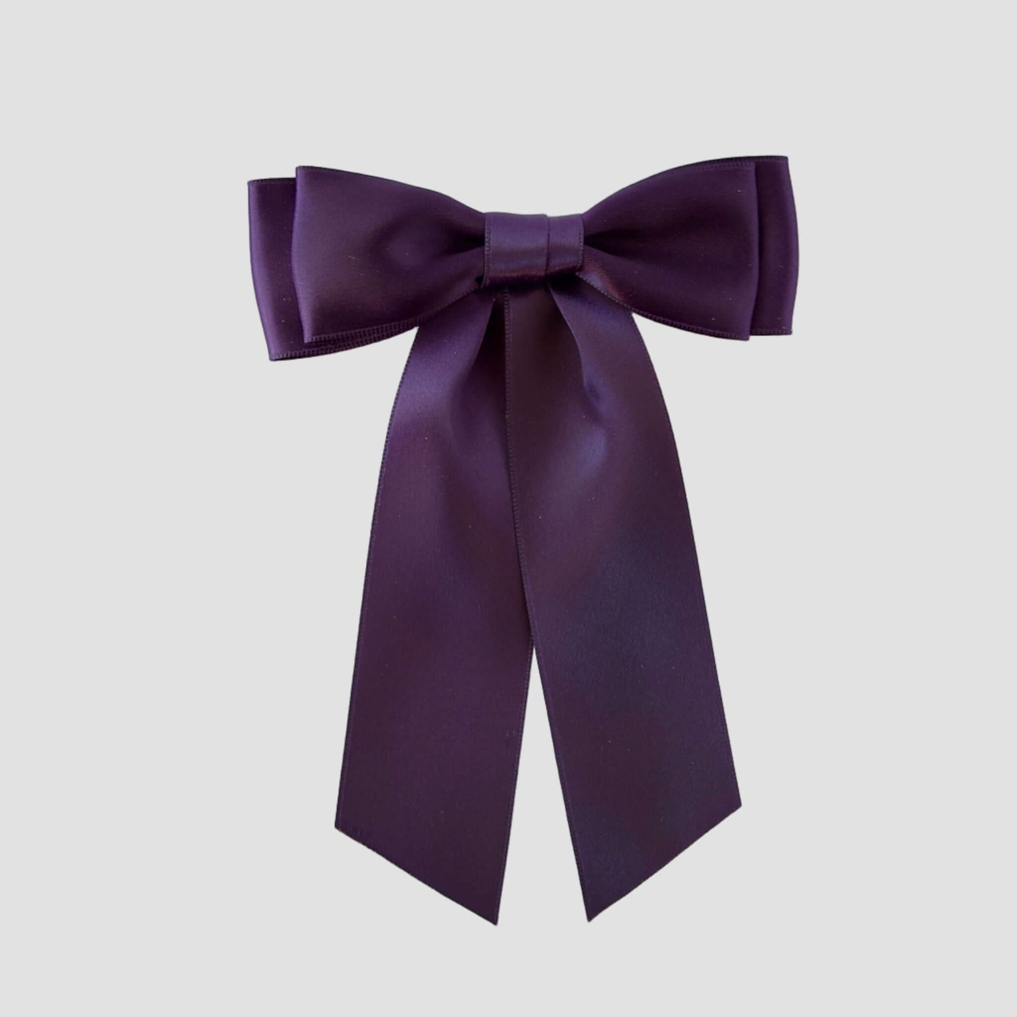 Mia Satin Hair Bow in Plum Purple on a white background