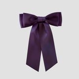 Mia Satin Hair Bow in Plum Purple on a white background