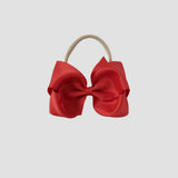 5 inch Grosgrain Penelope hair bow Headband in red on a white background