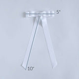 Ruler measurement on a white Bailee grosgrain bow.