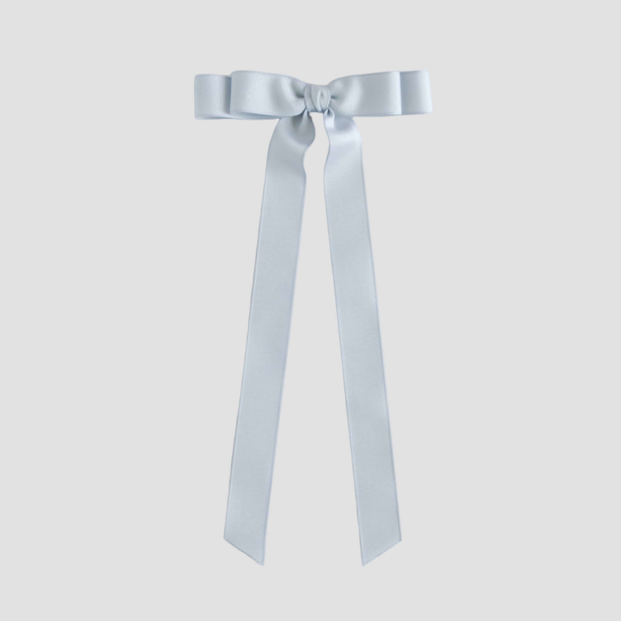 Silver grosgrain ribbon bow on a white background