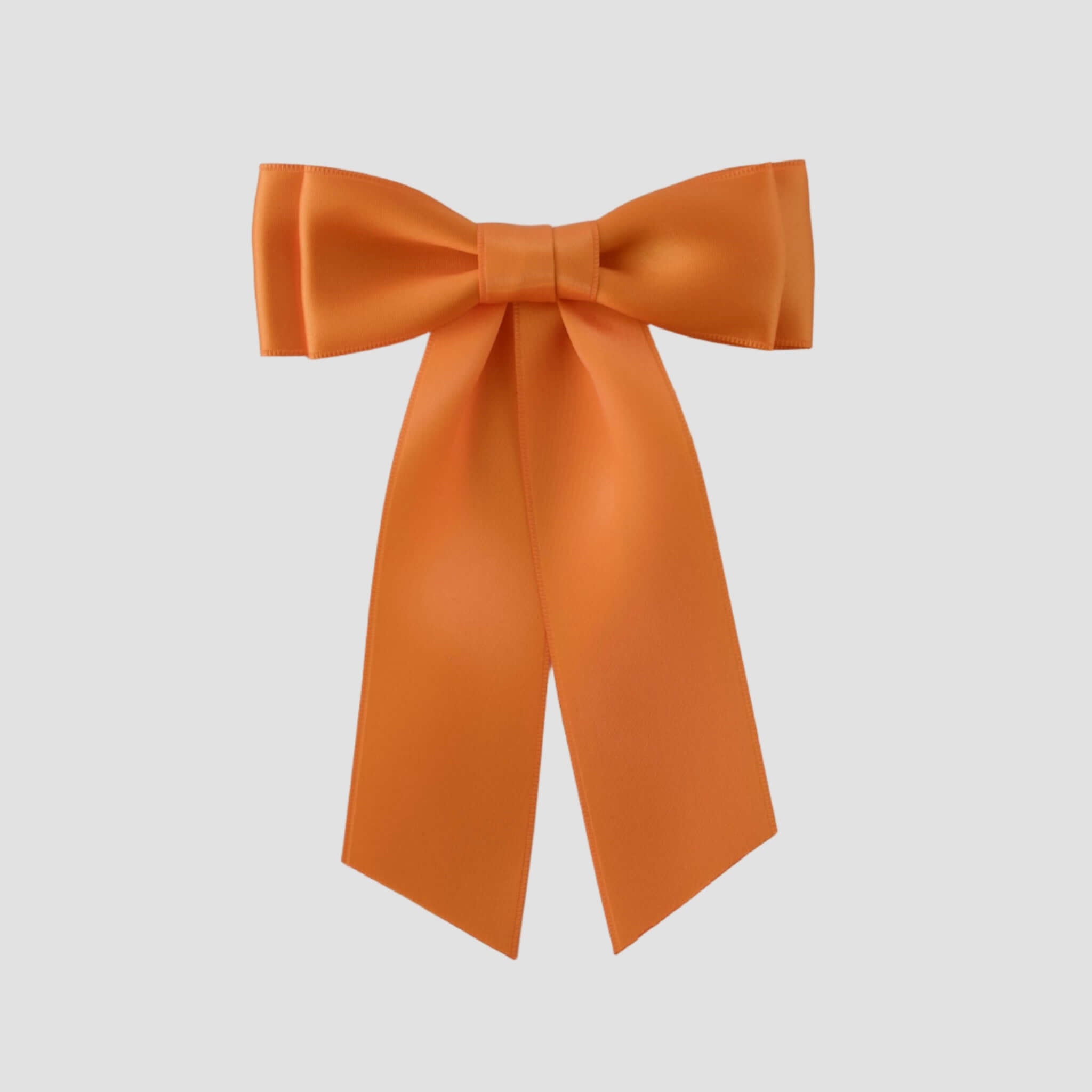 Mia Satin Hair Bow in Tangerine Orange on a white background