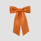 Mia Satin Hair Bow in Tangerine Orange on a white background
