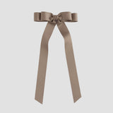 Taupe brown ribbon bow on a white background