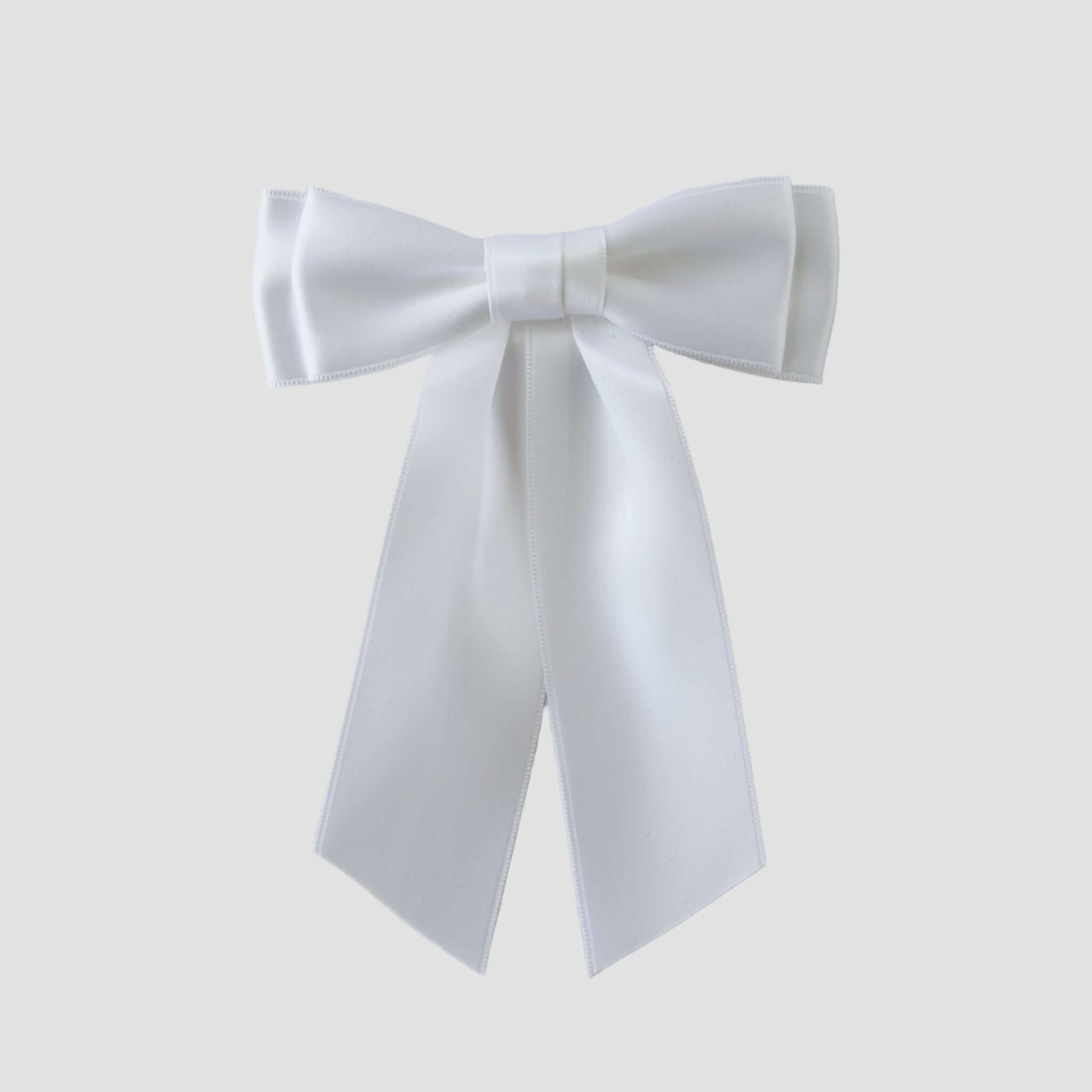 Mia Satin Hair Bow in white on a white background