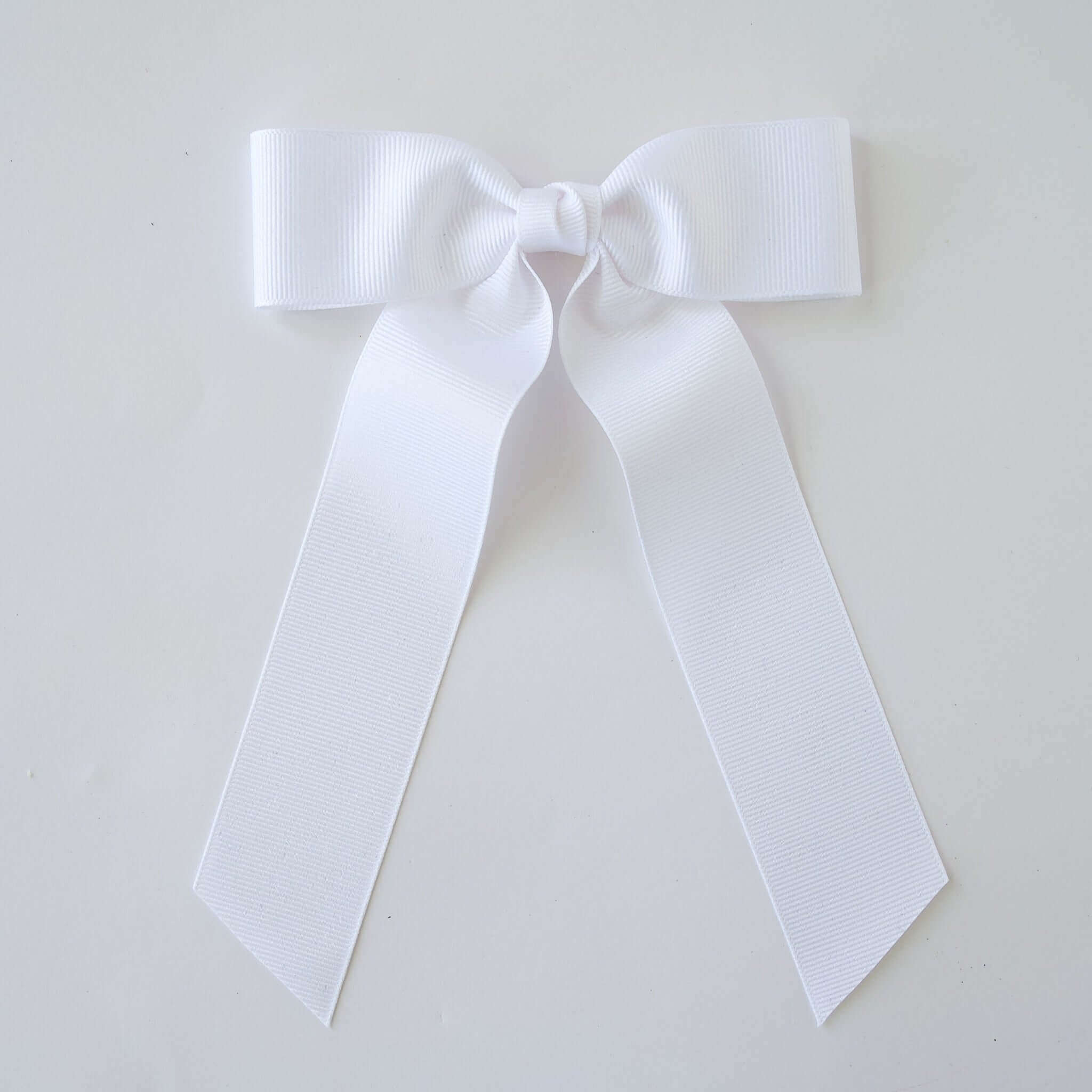 White grosgrain Zoe Petite bow on a white background