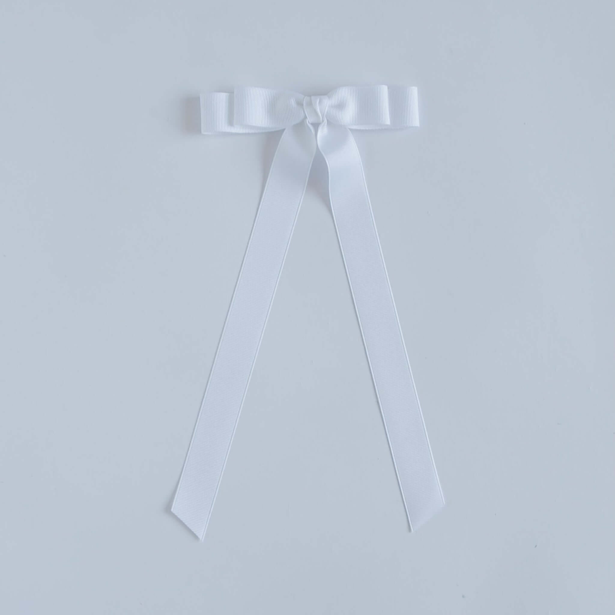 White ribbon bow on a white background