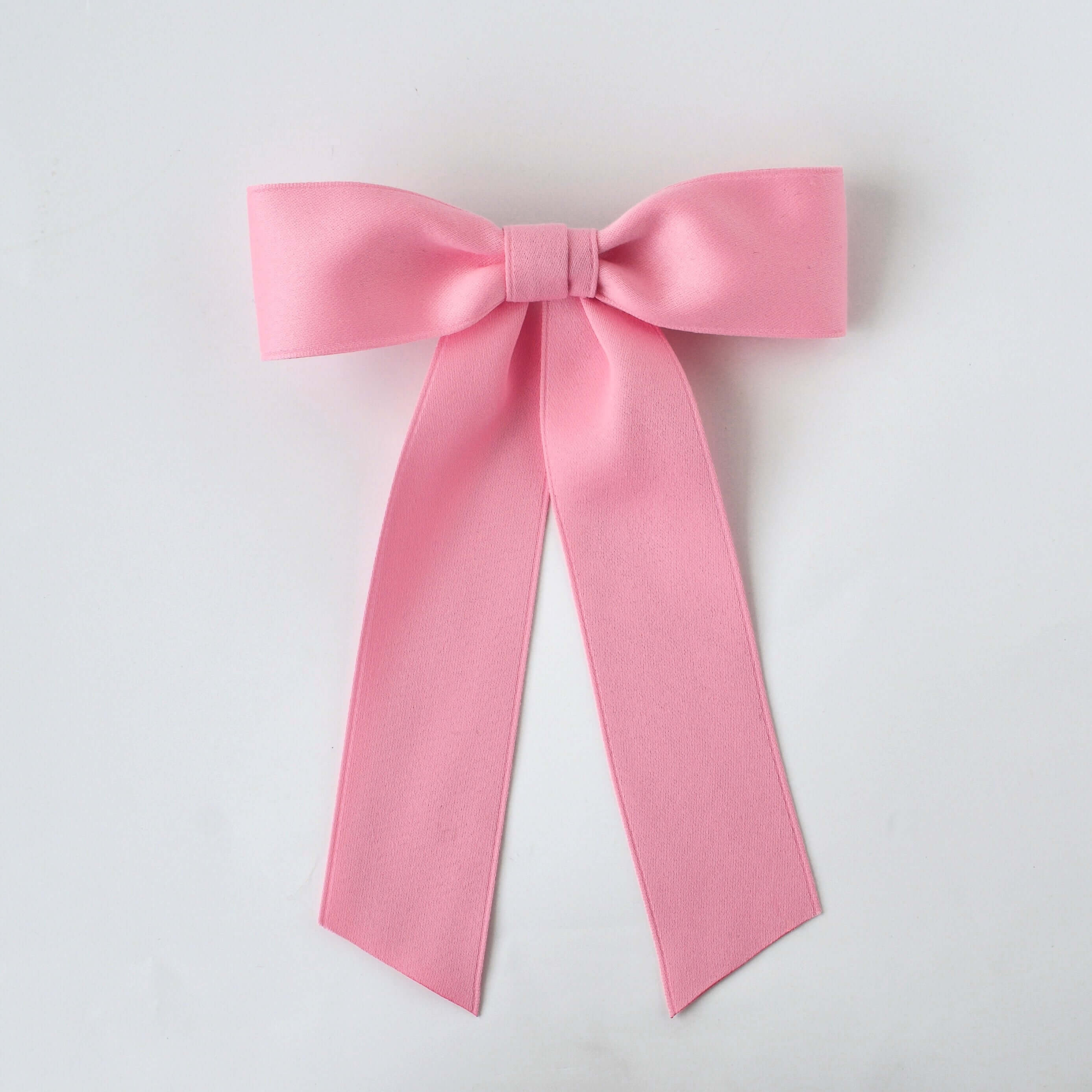 Sustainable recycled matte satin pink hair bow for women and girls, perfect for everyday and special occasions.