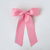 Sustainable recycled matte satin pink hair bow for women and girls, perfect for everyday and special occasions.