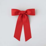 Sustainable recycled matte satin ribbon hair bow in vibrant red for women and girls, perfect for versatile styling.