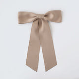 Sustainable recycled matte satin ribbon hair bow for women and girls in neutral beige color.