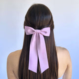 Zoe Matte Satin Bow in pink, oversized long tail handmade bow made from sustainable recycled matte satin ribbon.