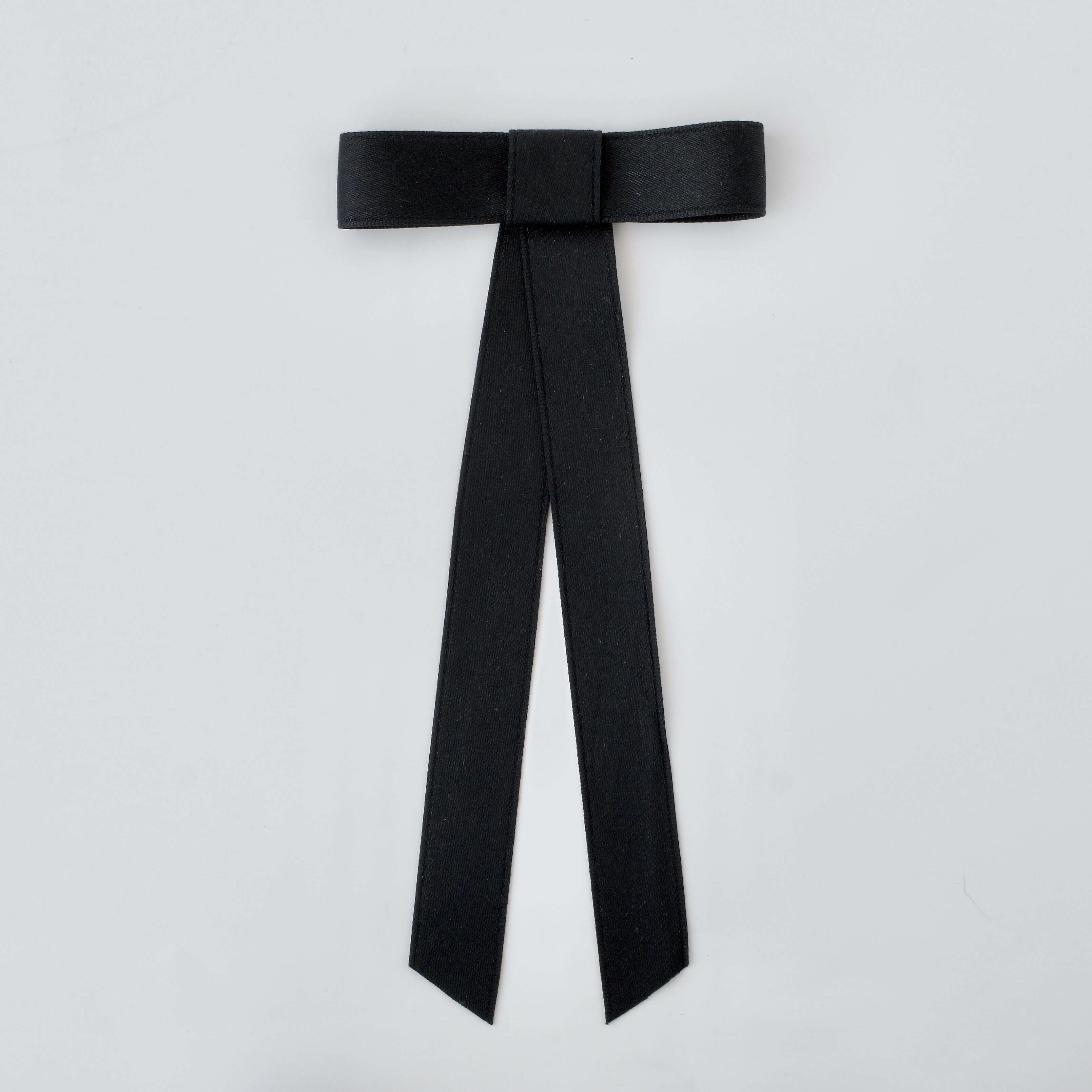 Zoe Mini Matte Satin Bow in black, handmade with eco-friendly recycled material for versatile hair styling.