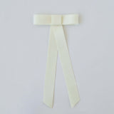 Zoe Mini Matte Satin Bow in ivory, handmade with eco-friendly recycled ribbon, perfect for hair styling and special occasions.