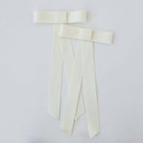 Zoe Mini Matte Satin Bow set in ivory, made from eco-friendly recycled material, perfect for versatile hairstyles.