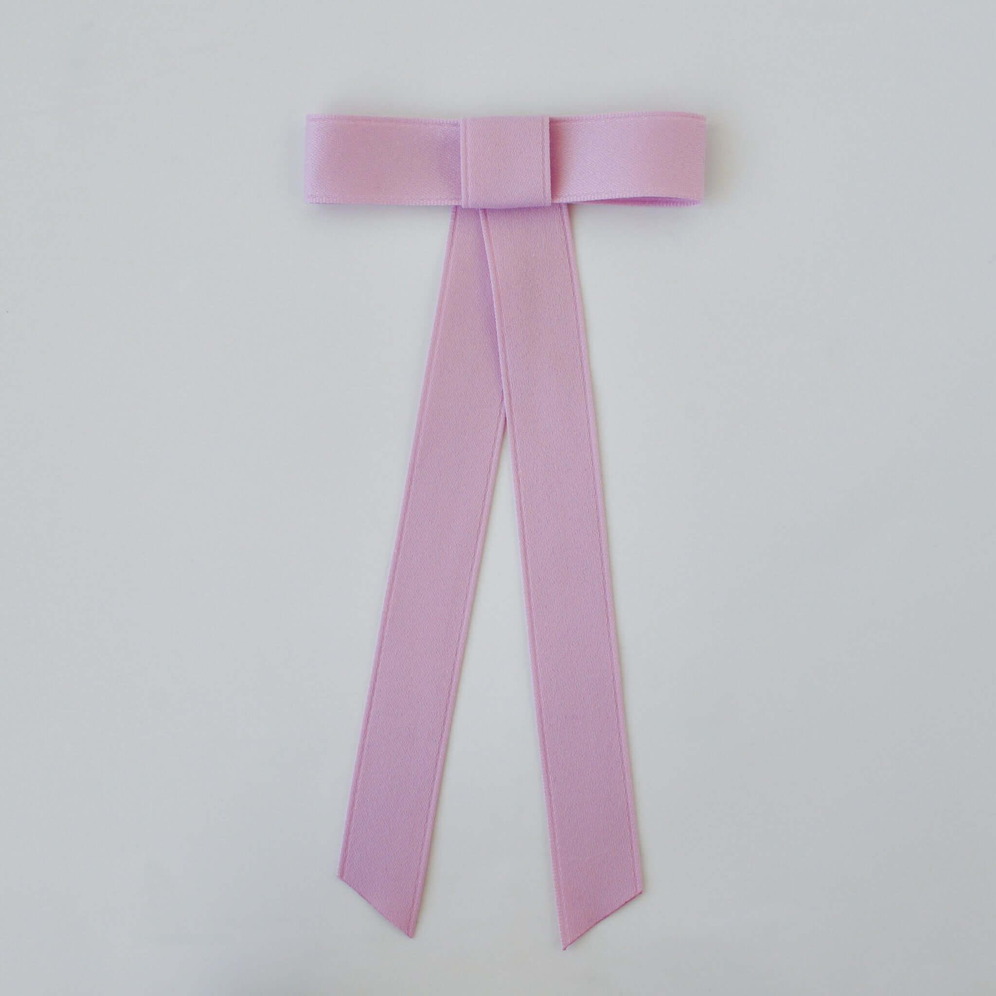 Zoe Mini Matte Satin Bow in pink, handmade from sustainable recycled ribbon for stylish hair accessories.