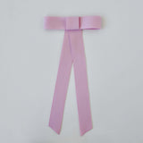 Zoe Mini Matte Satin Bow in pink, handmade from sustainable recycled ribbon for stylish hair accessories.