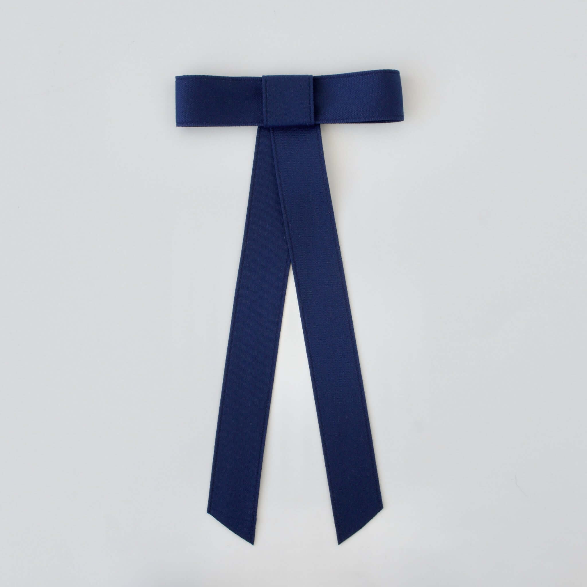 Zoe Mini Matte Satin Bow in navy, made from sustainable recycled material, perfect for stylish hair accessories.