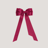 Azalea pink bow on a white background