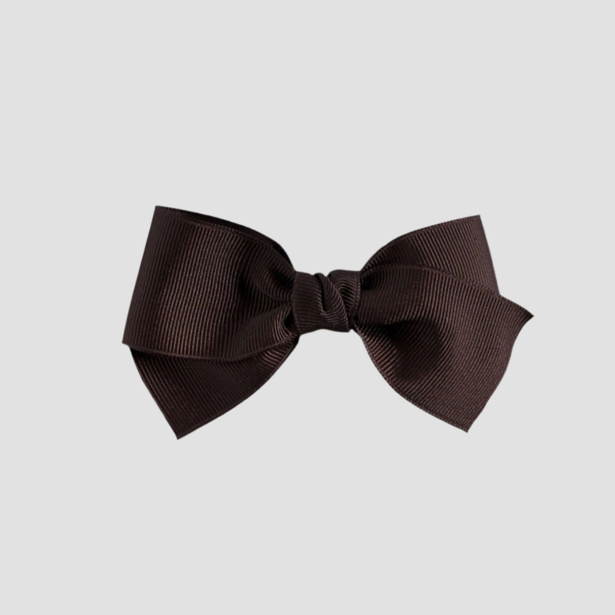 Brown hair bow on a white background