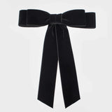 Elegant velvet hair bows for chic hairstyles and versatile styling.