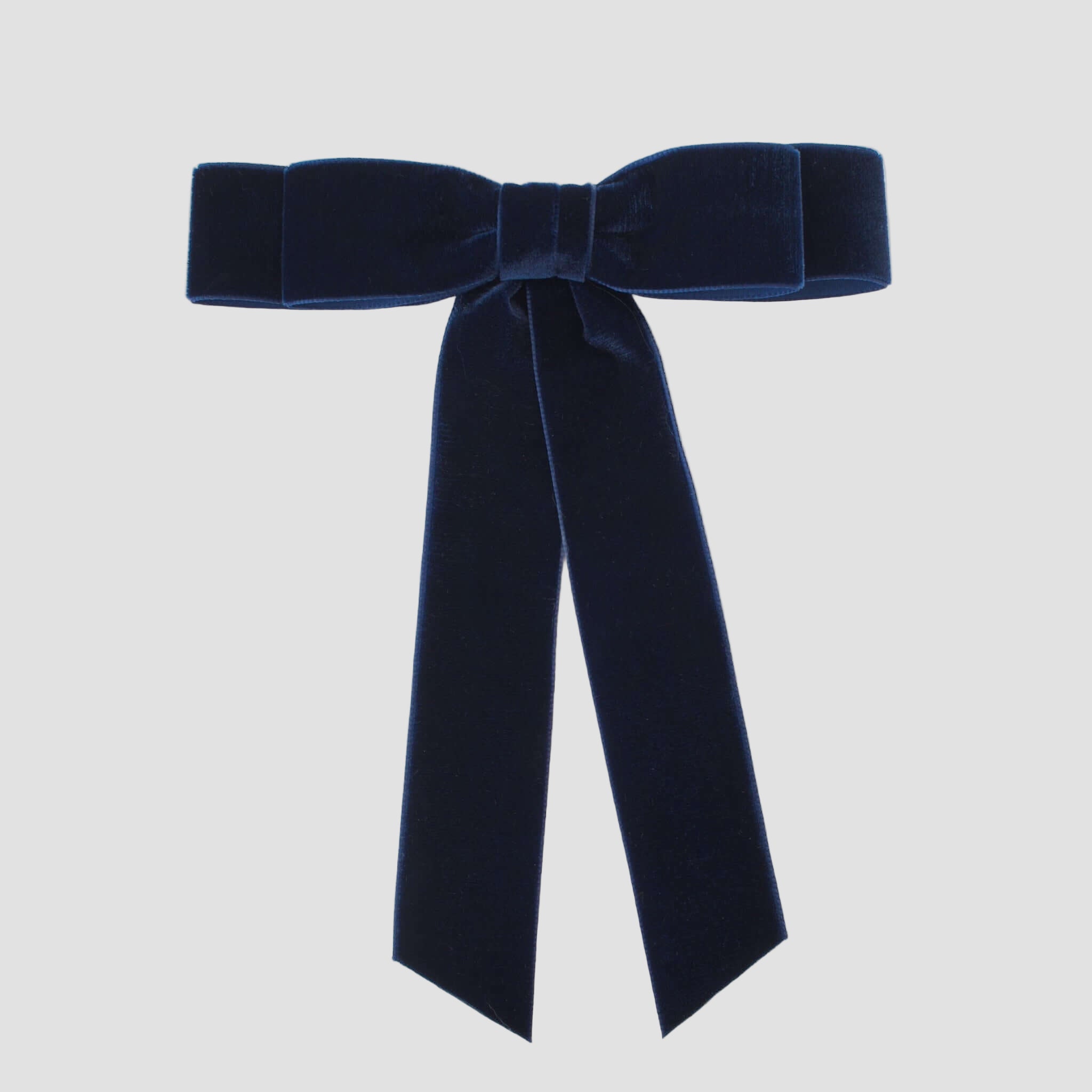Grace velvet hair bow in navy on a white background.