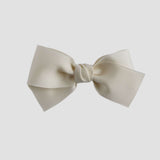 ivory colored bow on white background
