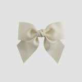 Ivory colored bow on a white background
