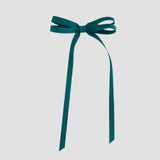 Jade green ribbon bow on a white background