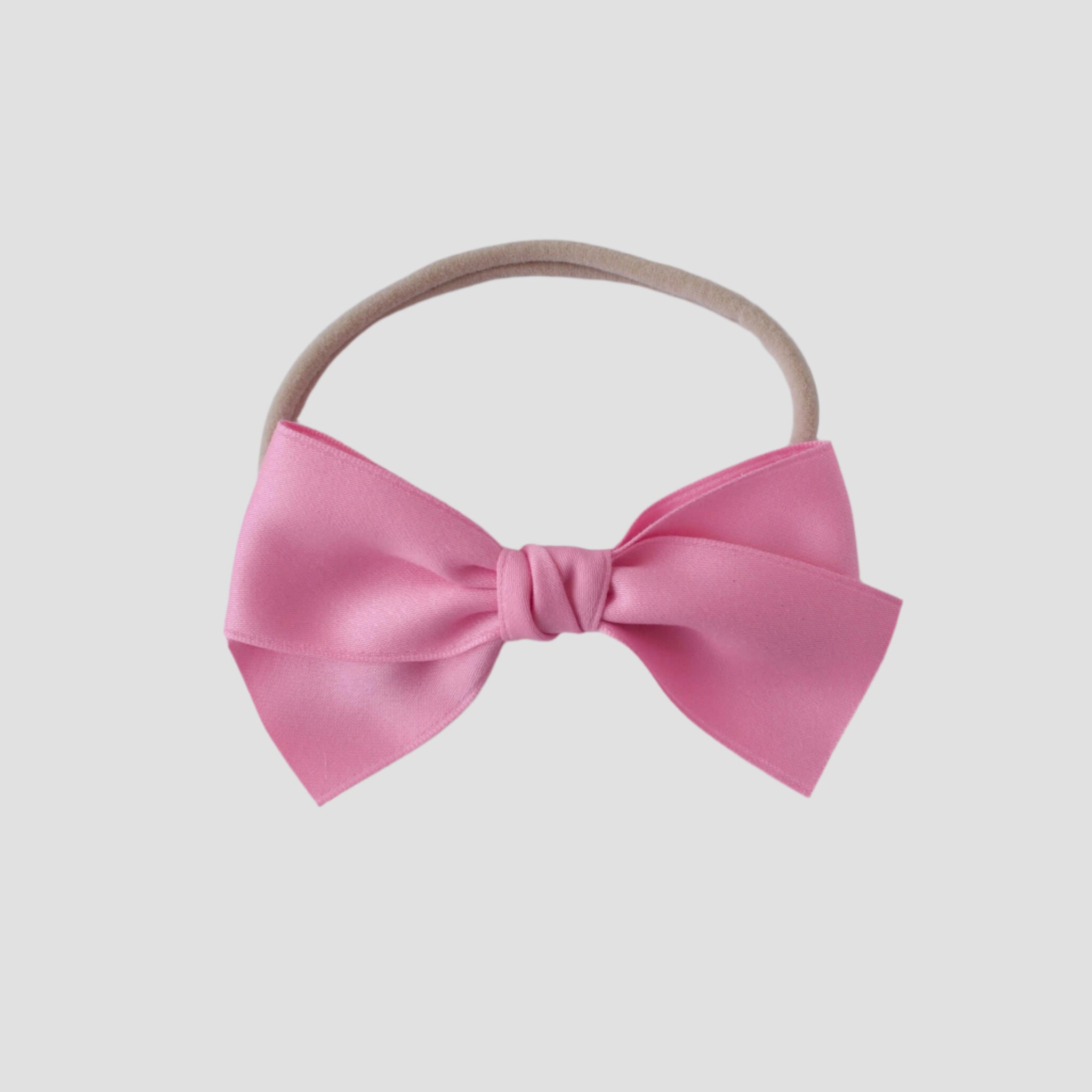 Sustainable recycled polyester matte satin bow headband for newborns to toddlers in pink
