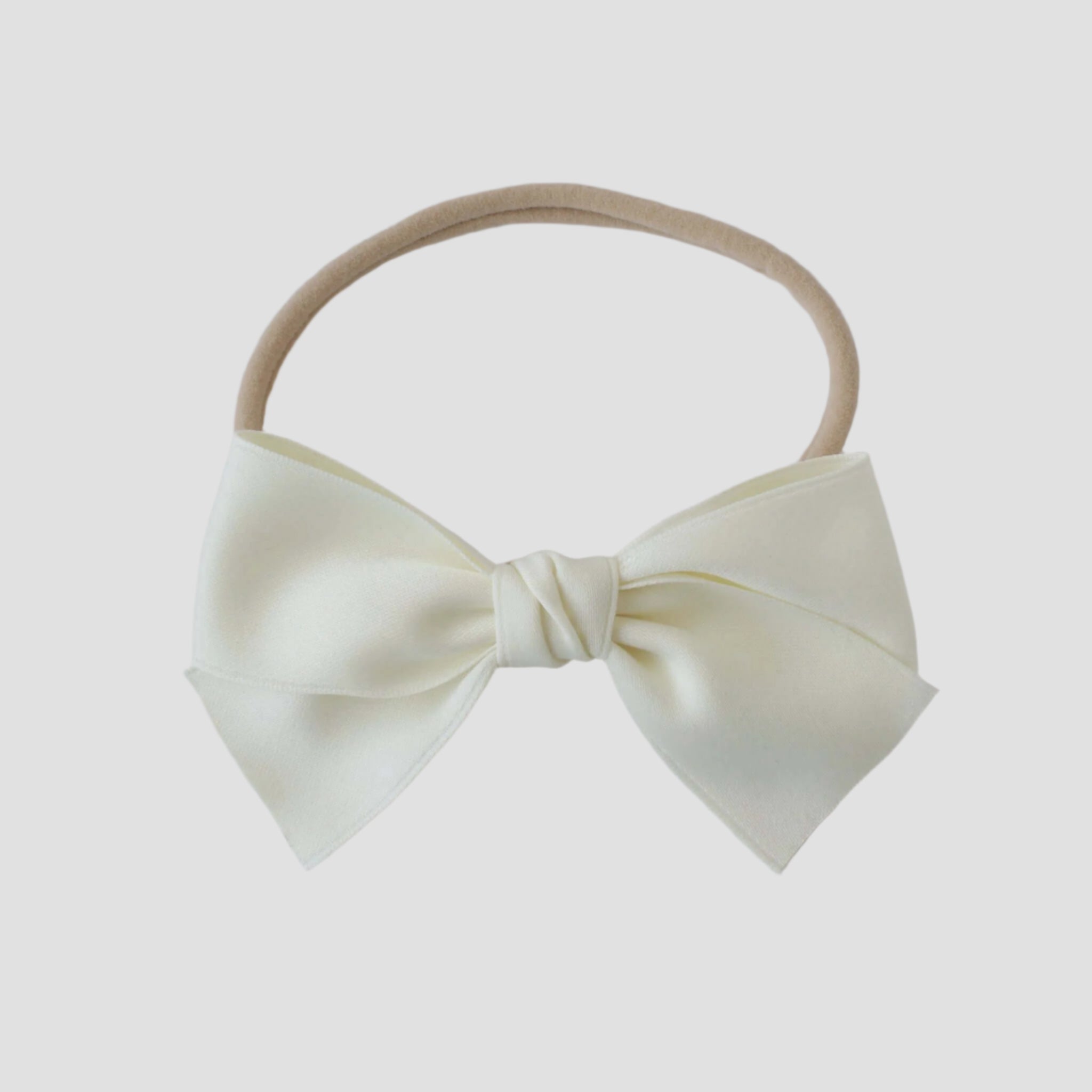 Sustainable recycled polyester matte satin bow headband for newborns to toddlers in ivory